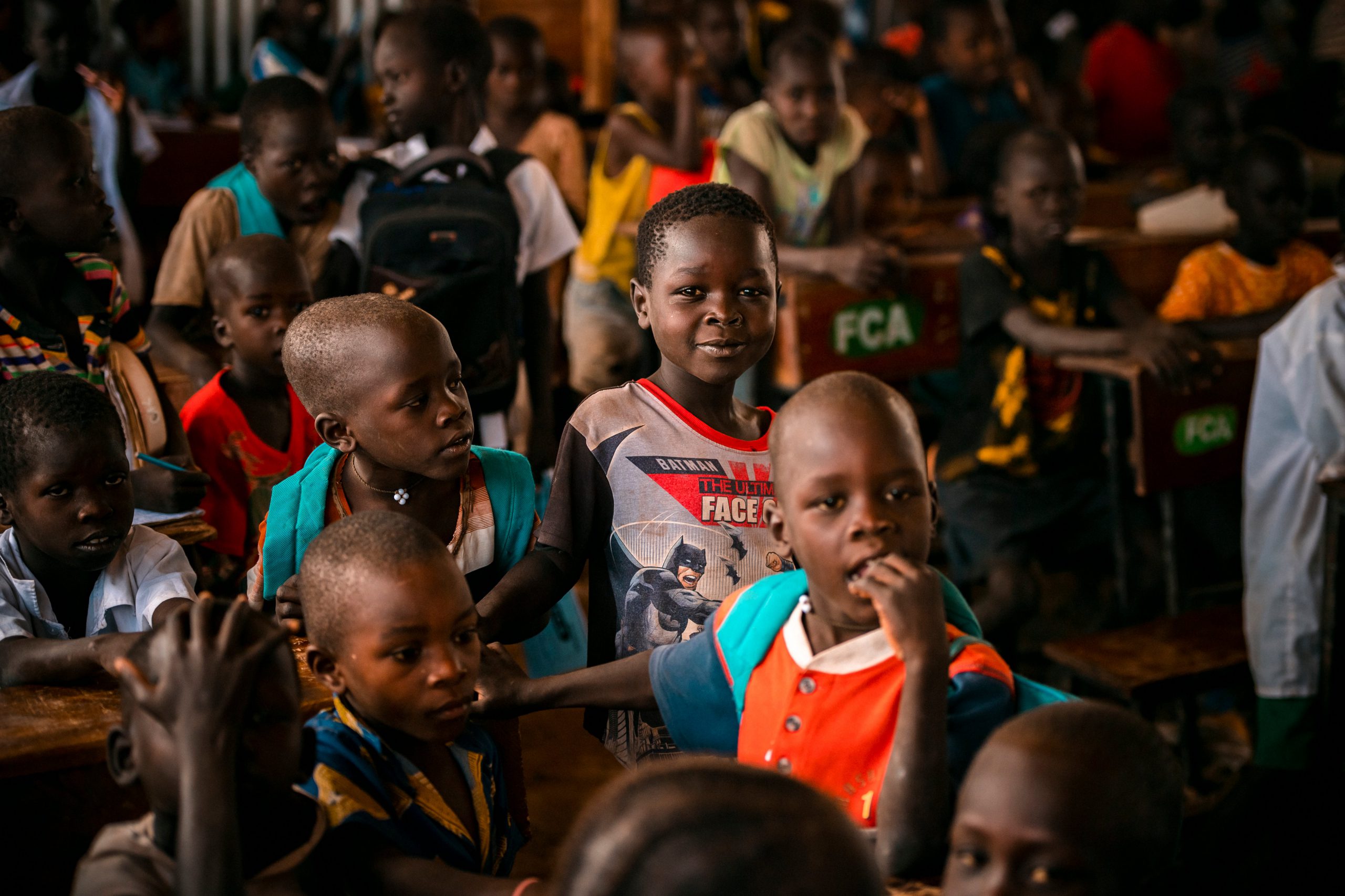 a classroom crowded with refugees