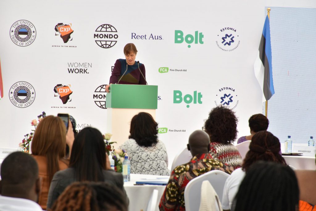 Woman speaking in front of audience.