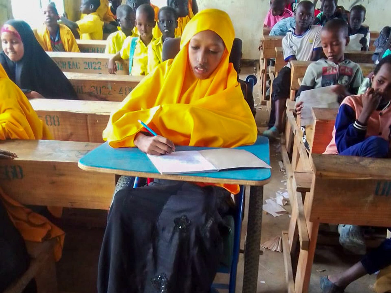 Halimo Abdalla, in her classroom at Dadaab, focused on her assignment.